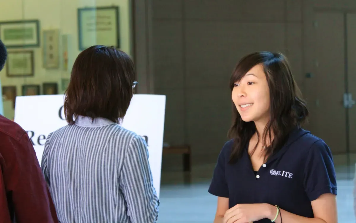 An Elite Prep staff member greeting a visitor