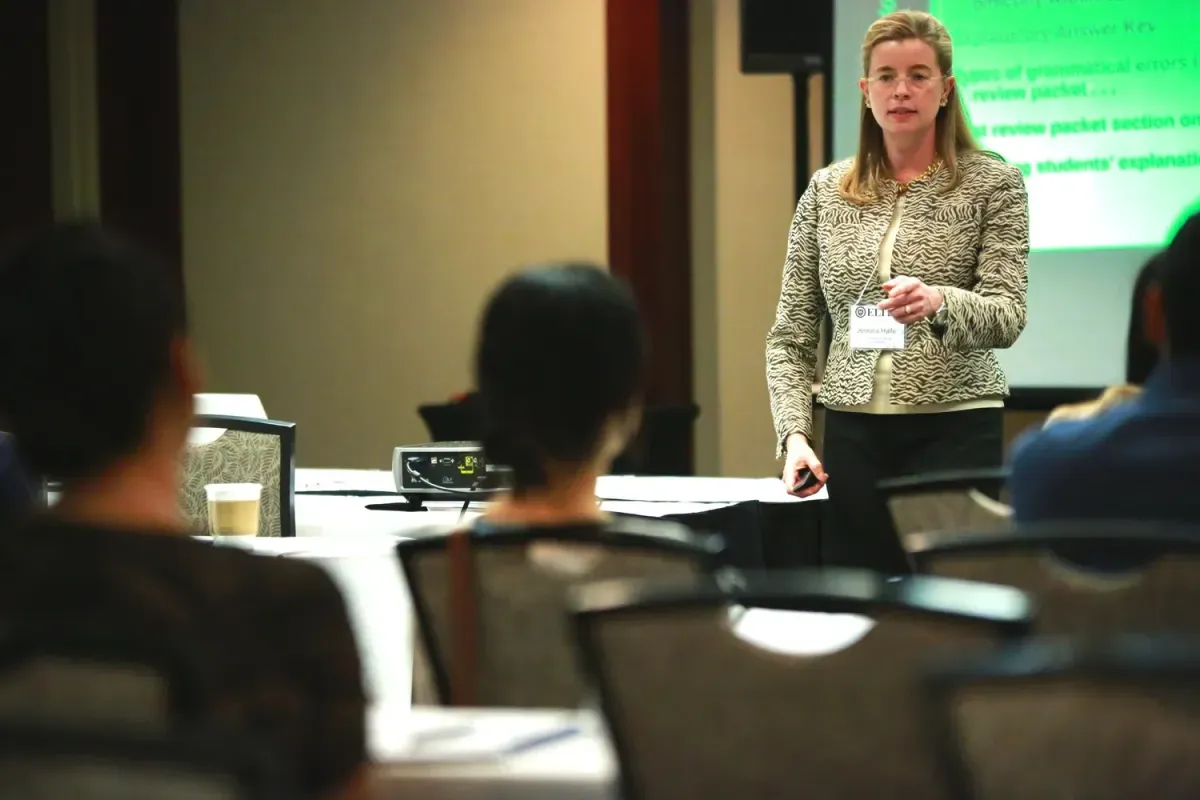 A presenter speaking at a training session