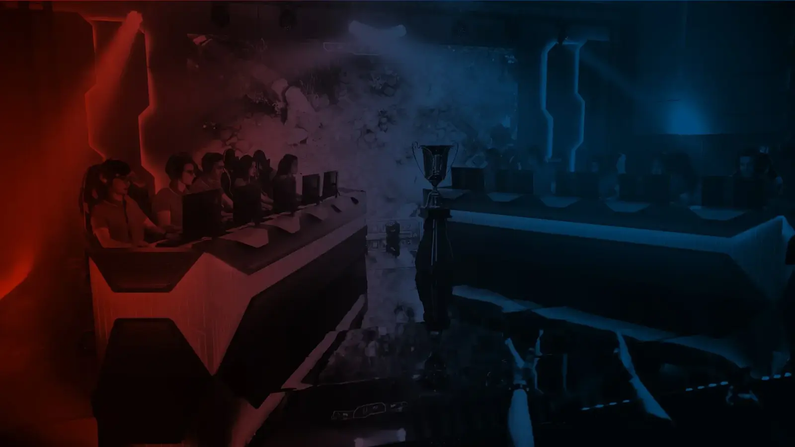 Esports teams at computers on a tournament stage, bathed in red and blue light with a trophy at center.