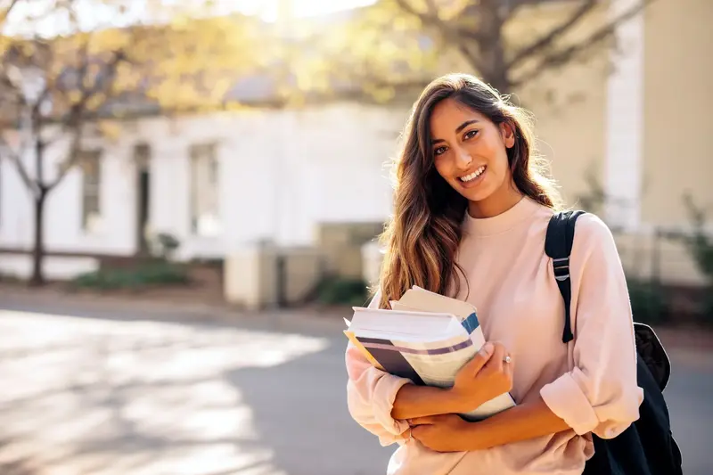 Student holding textbooks